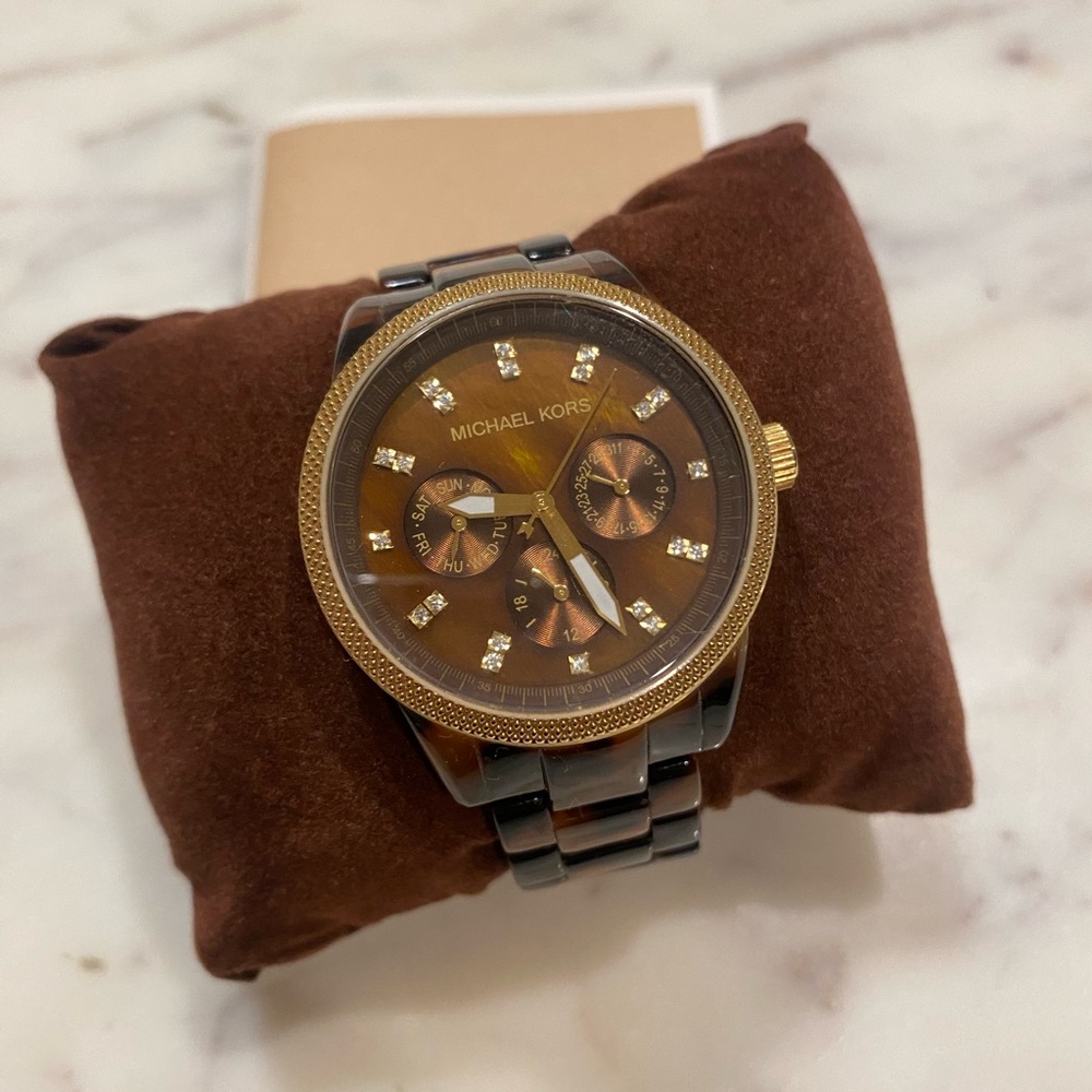 Michael Kors tortoise shell watch with gold and rhinestone detail